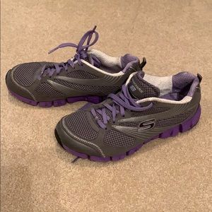 Sketchers sport grey and purple shoes. Size: 7